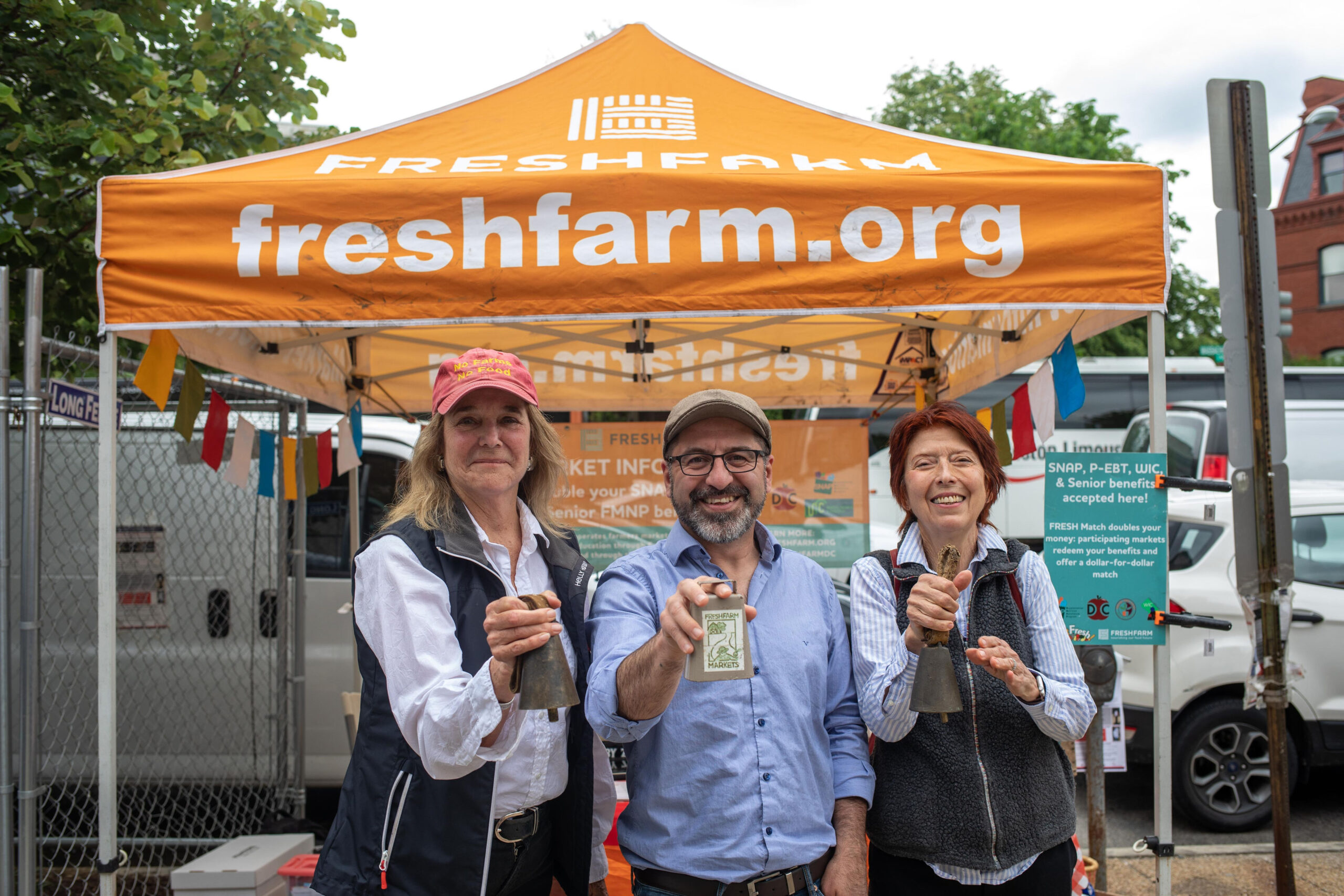 This image depicts the founders of the FRESHFARM non-profit with the current executive director at the opening day of the new Thursday Dupont Circle farmers market.