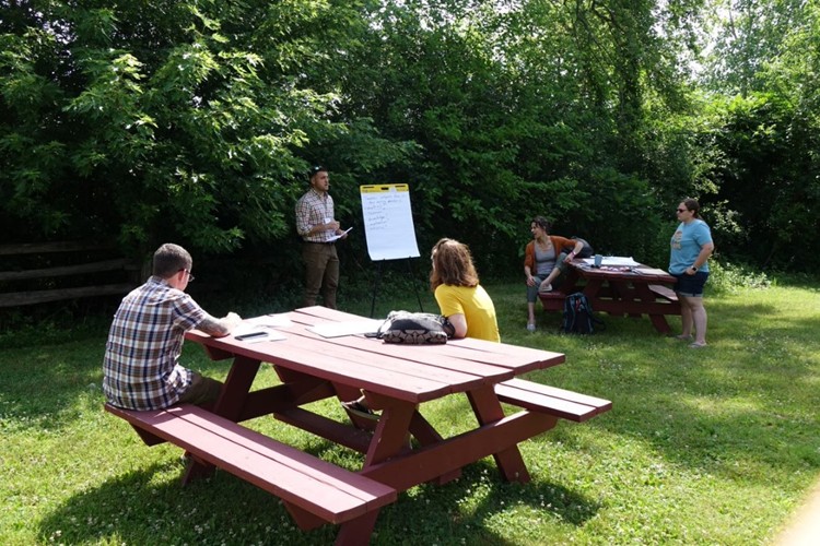 Participants attend a workshop outdoors