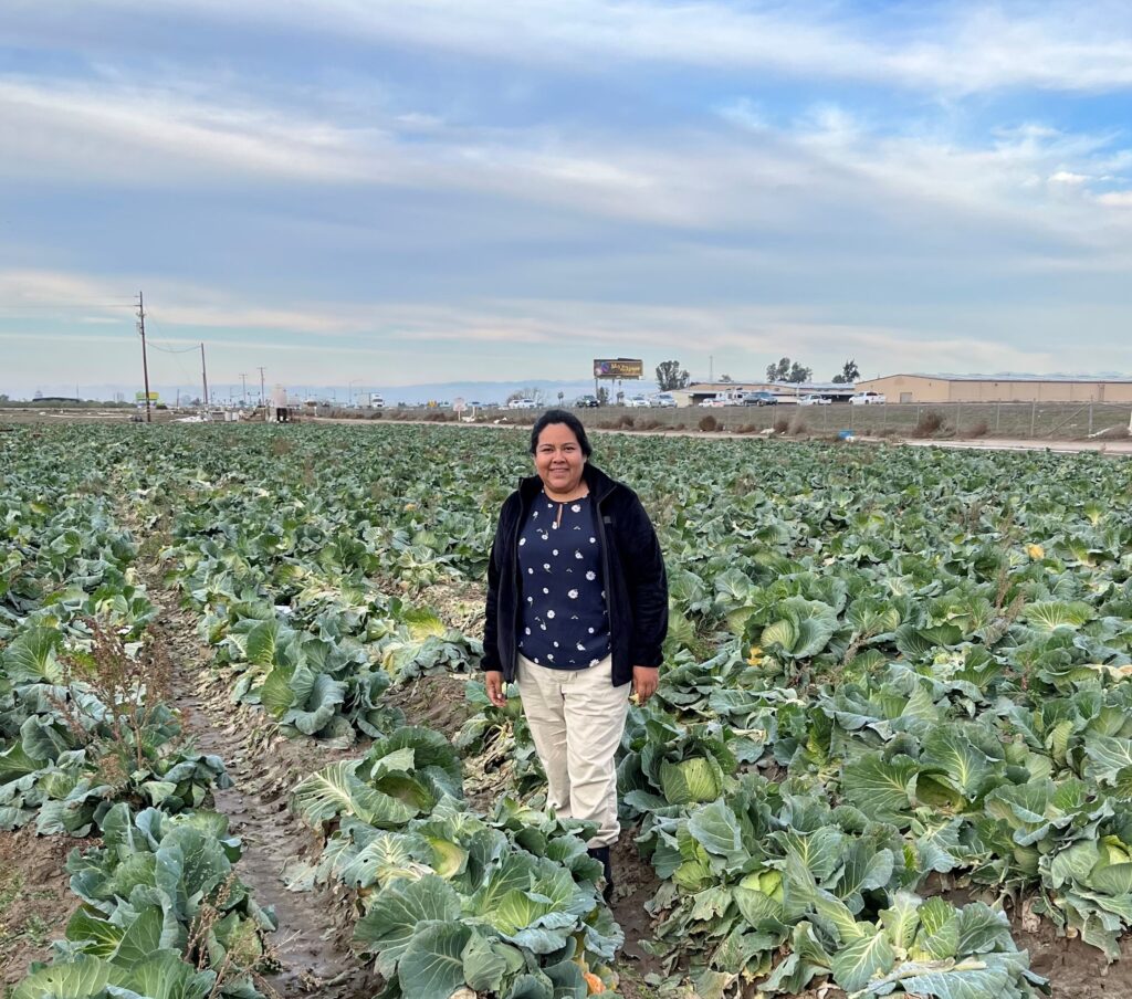 Standing in a small scale farm in Fresno California
