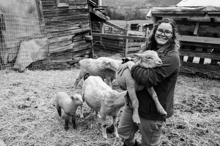 Olivia Fuller holds a lamb